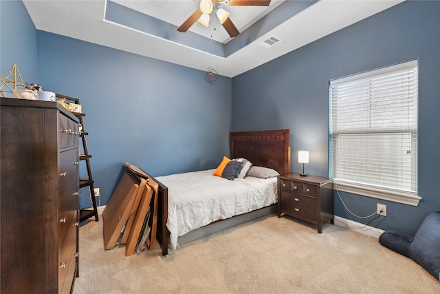 2619 Portland Ave, College Station, TX 77845 - carpeted bedroom featuring a raised ceiling and ceiling fan
