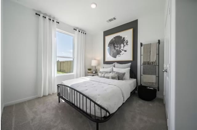 16424 Windy Cove Ct, Conroe, TX 77378 - bedroom featuring carpet floors and baseboards