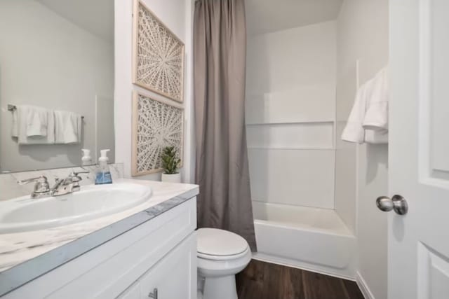 16424 Windy Cove Ct, Conroe, TX 77378 - full bath featuring vanity, shower / bathtub combination with curtain, and wood finished floors