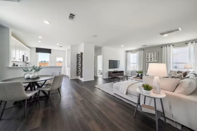 16424 Windy Cove Ct, Conroe, TX 77378 - living room featuring dark wood finished floors and recessed lighting