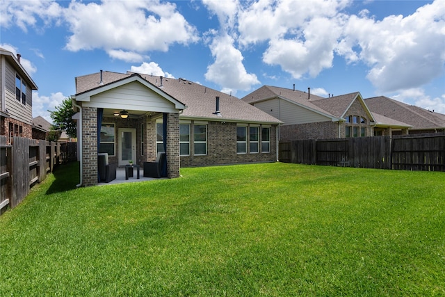 18723 Pilot Knolls Dr, Cypress, TX 77433 - back of property with ceiling fan, a patio area, a fenced backyard, and brick siding