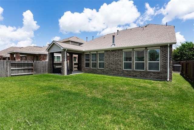 18723 Pilot Knolls Dr, Cypress, TX 77433 - back of house with brick siding, a fenced backyard, roof with shingles, and a patio