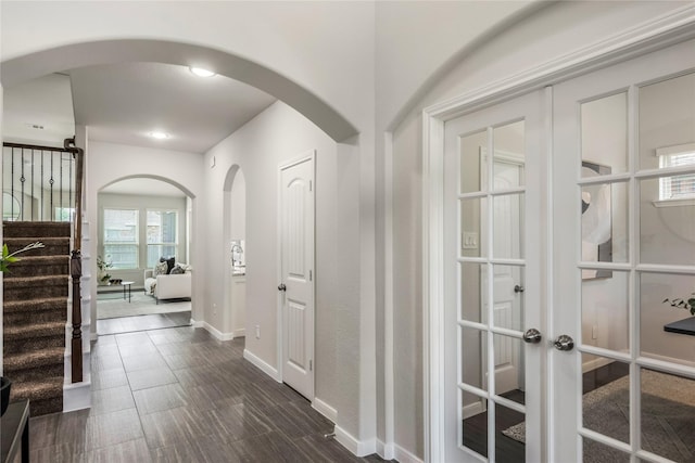 18723 Pilot Knolls Dr, Cypress, TX 77433 - hall with stairway, french doors, arched walkways, and recessed lighting
