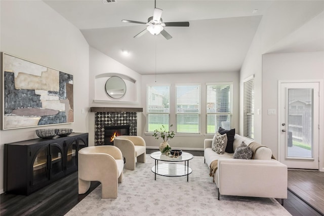 18723 Pilot Knolls Dr, Cypress, TX 77433 - living area featuring lofted ceiling, wood finished floors, a ceiling fan, and a tile fireplace