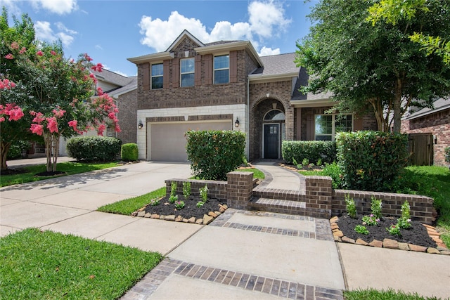 18723 Pilot Knolls Dr, Cypress, TX 77433 - traditional-style home featuring driveway, brick siding, a garage, and a shingled roof