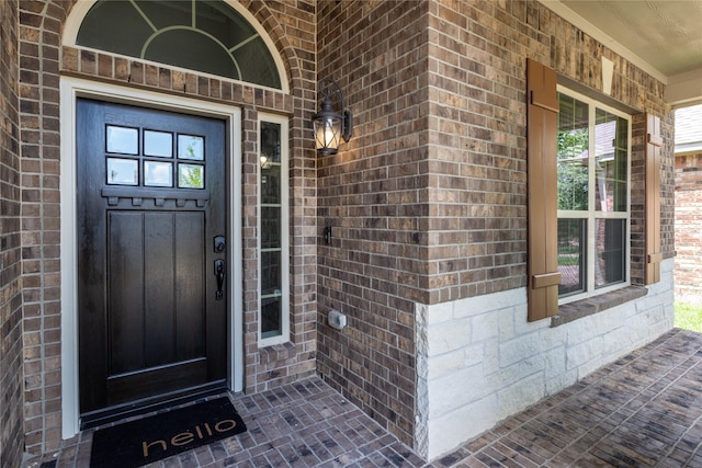 18723 Pilot Knolls Dr, Cypress, TX 77433 - doorway to property featuring brick siding and covered porch