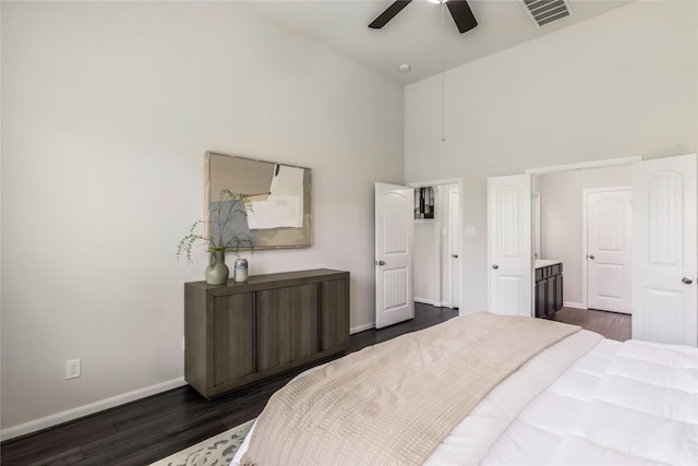 18723 Pilot Knolls Dr, Cypress, TX 77433 - bedroom with a towering ceiling, dark wood-style flooring, and a ceiling fan