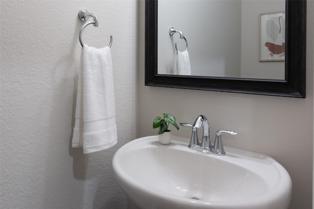 18723 Pilot Knolls Dr, Cypress, TX 77433 - bathroom featuring a sink and a textured wall