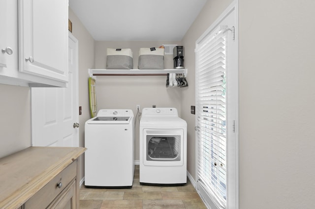17214 Shadow Valley Dr, Spring, TX 77379 - laundry area with cabinet space and washer and clothes dryer