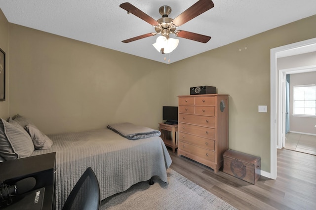 17214 Shadow Valley Dr, Spring, TX 77379 - bedroom featuring wood finished floors and ceiling fan