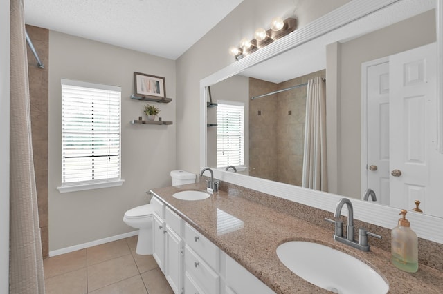 17214 Shadow Valley Dr, Spring, TX 77379 - full bath with plenty of natural light, tile patterned floors, double vanity, and a tile shower