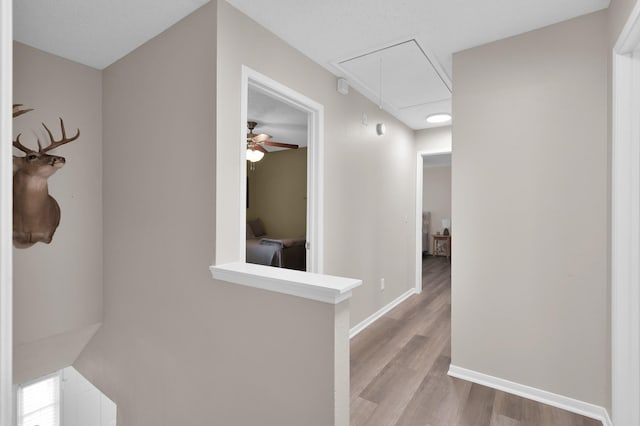 17214 Shadow Valley Dr, Spring, TX 77379 - hall with attic access and wood finished floors