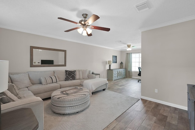 17214 Shadow Valley Dr, Spring, TX 77379 - living room featuring a ceiling fan, wood finished floors, and crown molding