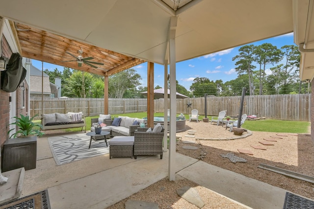17214 Shadow Valley Dr, Spring, TX 77379 - fenced backyard featuring an outdoor hangout area, a patio area, and a ceiling fan