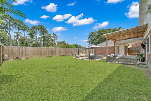 17214 Shadow Valley Dr, Spring, TX 77379 - fenced backyard featuring a jacuzzi, an outdoor hangout area, and a patio area