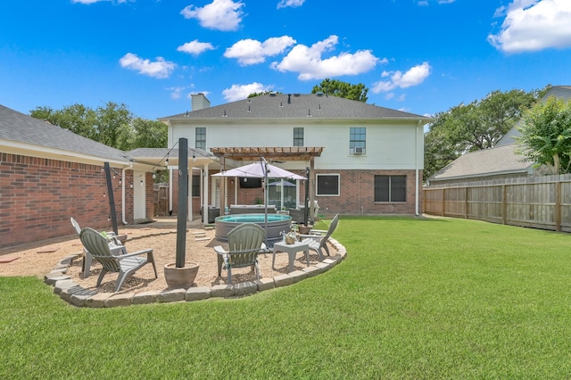17214 Shadow Valley Dr, Spring, TX 77379 - rear view of property with a hot tub, a pergola, brick siding, and a fenced backyard
