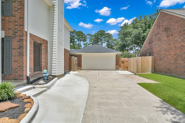 17214 Shadow Valley Dr, Spring, TX 77379 - view of property exterior with brick siding, concrete driveway, a garage, a gate, and a shingled roof