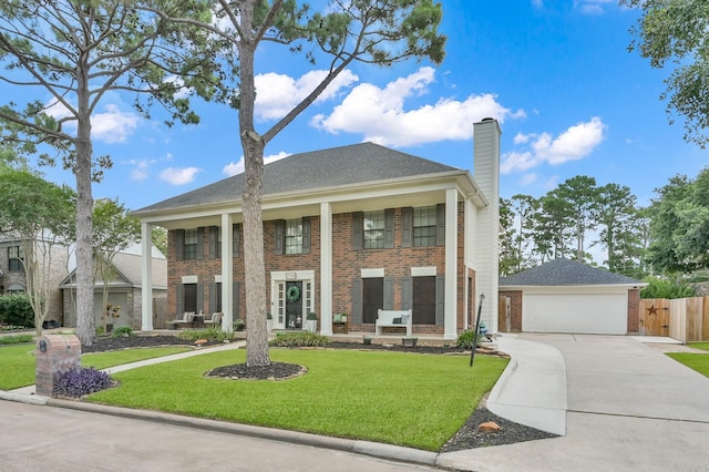 17214 Shadow Valley Dr, Spring, TX 77379 - neoclassical / greek revival house featuring brick siding, a chimney, and concrete driveway