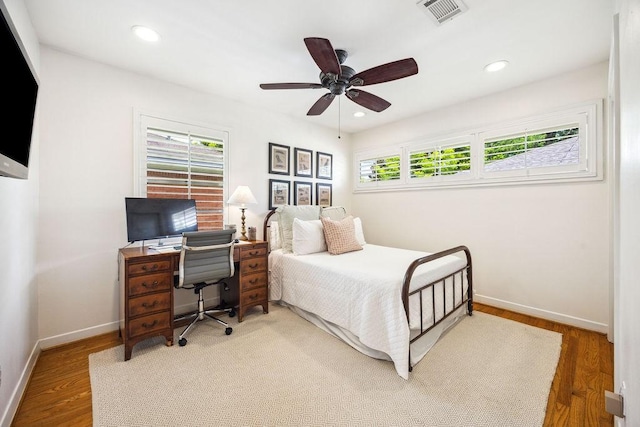 2031 Cheshire Ln, Houston, TX 77018 - bedroom with an office area, wood finished floors, recessed lighting, and ceiling fan