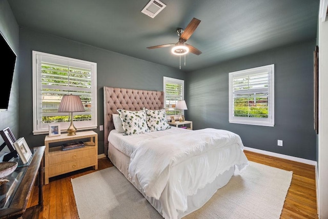 2031 Cheshire Ln, Houston, TX 77018 - bedroom featuring multiple windows, wood finished floors, and a ceiling fan