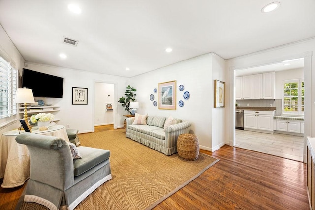 2031 Cheshire Ln, Houston, TX 77018 - living room with recessed lighting, light wood finished floors, and crown molding