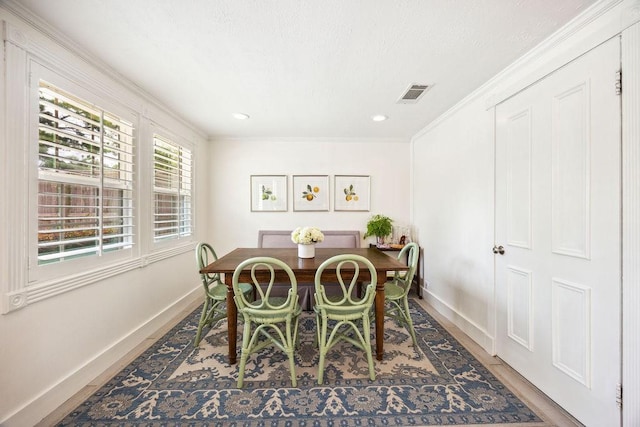 2031 Cheshire Ln, Houston, TX 77018 - dining space featuring ornamental molding, wood finished floors, and recessed lighting