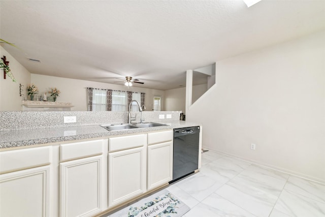 3530 Barkers Crossing Ave, Houston, TX 77084 - kitchen featuring dishwasher, light countertops, light marble finish flooring, a ceiling fan, and white cabinets