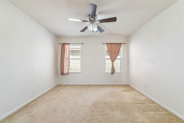 3530 Barkers Crossing Ave, Houston, TX 77084 - empty room featuring light colored carpet, ceiling fan, and a textured ceiling