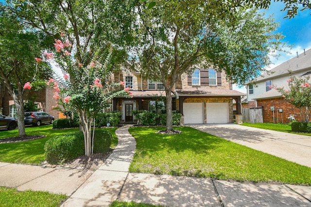 5506 Plumero Meadow Dr, Katy, TX 77494 - view of front of home featuring an attached garage, driveway, and stone siding