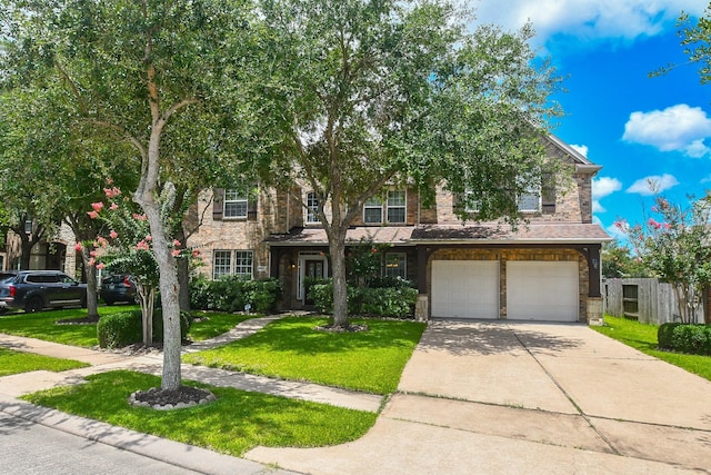 5506 Plumero Meadow Dr, Katy, TX 77494 - view of front of home with a garage, driveway, stone siding, and brick siding