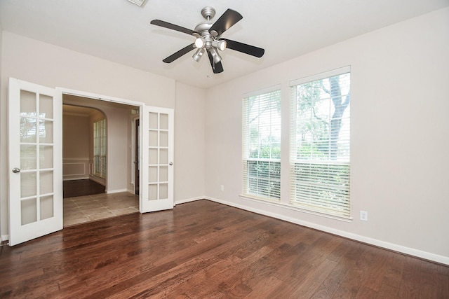 5506 Plumero Meadow Dr, Katy, TX 77494 - unfurnished room with french doors, wood finished floors, arched walkways, and ceiling fan