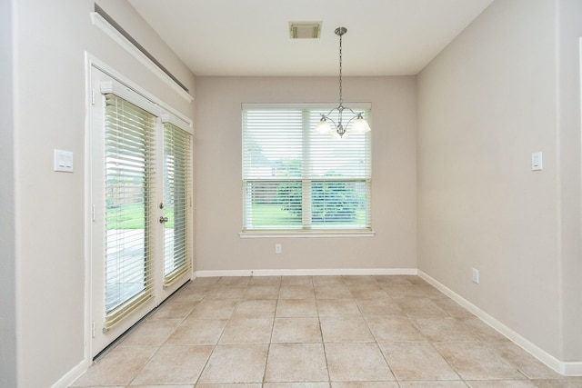 5506 Plumero Meadow Dr, Katy, TX 77494 - unfurnished dining area featuring a chandelier and light tile patterned floors