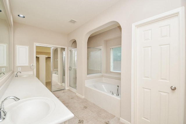 5506 Plumero Meadow Dr, Katy, TX 77494 - full bathroom featuring a shower stall, a bath, double vanity, and tile patterned flooring