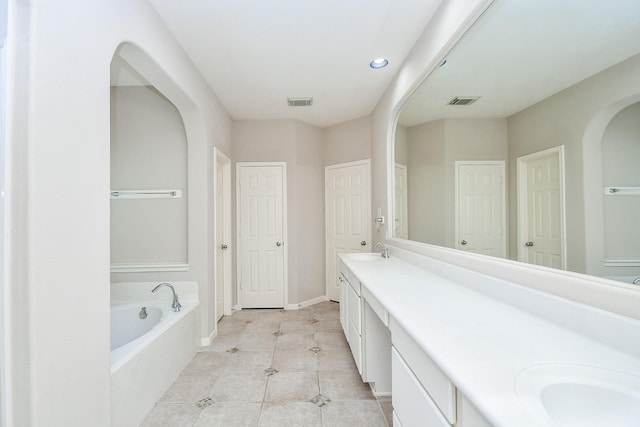 5506 Plumero Meadow Dr, Katy, TX 77494 - bathroom with double vanity, a garden tub, tile patterned floors, and recessed lighting