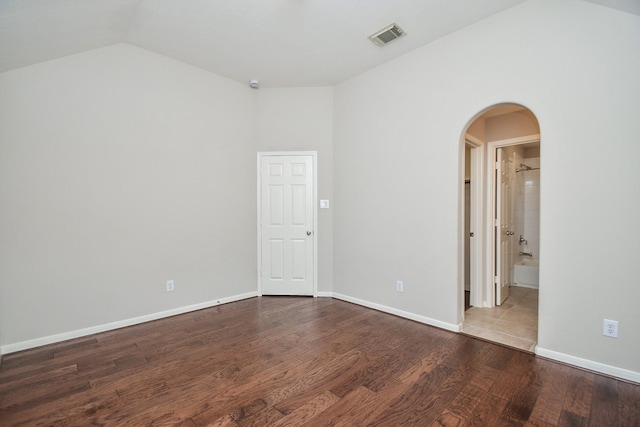 5506 Plumero Meadow Dr, Katy, TX 77494 - unfurnished room featuring vaulted ceiling, arched walkways, and wood finished floors