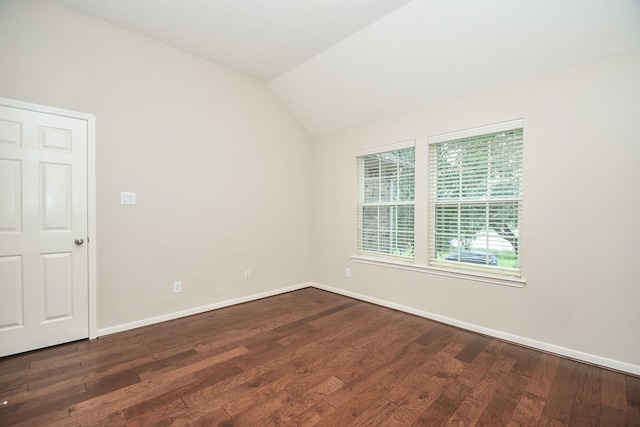 5506 Plumero Meadow Dr, Katy, TX 77494 - empty room featuring dark wood-type flooring and vaulted ceiling
