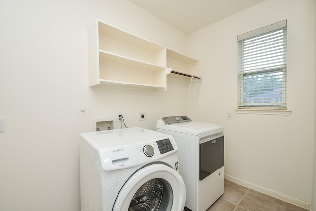 5506 Plumero Meadow Dr, Katy, TX 77494 - laundry room with washer and dryer and light tile patterned flooring