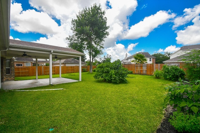 5506 Plumero Meadow Dr, Katy, TX 77494 - fenced backyard with a ceiling fan and a patio