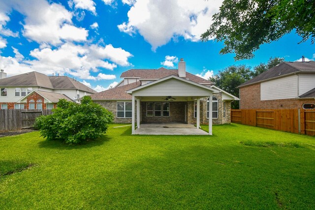 5506 Plumero Meadow Dr, Katy, TX 77494 - rear view of property featuring a ceiling fan, a patio area, a fenced backyard, and a chimney