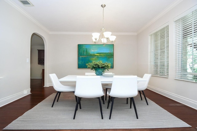 5506 Plumero Meadow Dr, Katy, TX 77494 - dining area with wood finished floors, arched walkways, crown molding, and a chandelier