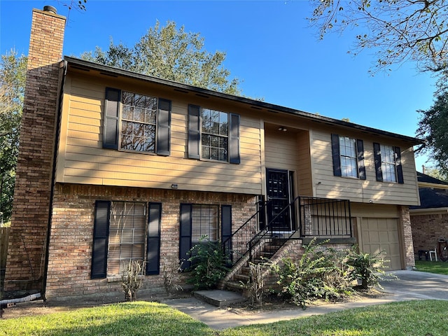 8426 Laurel Trails Dr, Houston, TX 77095 - split foyer home with an attached garage, concrete driveway, brick siding, and a chimney