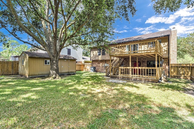 8426 Laurel Trails Dr, Houston, TX 77095 - rear view of house featuring a deck, a fenced backyard, a storage shed, brick siding, and stairway
