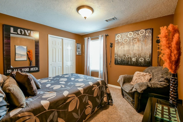 18303 June Forest Dr, Humble, TX 77346 - bedroom with carpet, a closet, and a textured ceiling