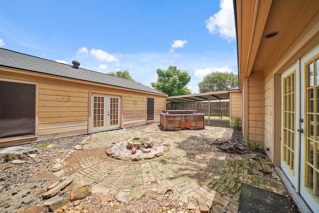 10803 Shawnbrook Dr, Houston, TX 77071 - view of patio / terrace with french doors and a hot tub