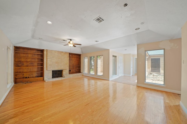 10803 Shawnbrook Dr, Houston, TX 77071 - unfurnished living room with vaulted ceiling, built in features, a fireplace, healthy amount of natural light, and ceiling fan