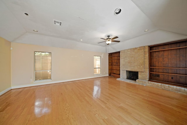 10803 Shawnbrook Dr, Houston, TX 77071 - unfurnished living room with built in shelves, vaulted ceiling, plenty of natural light, ceiling fan, and wood finished floors