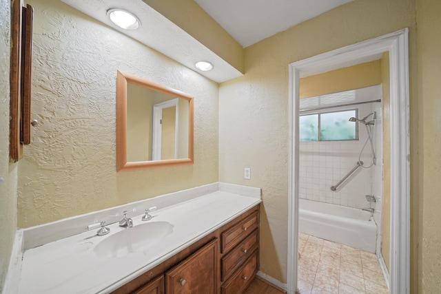 10803 Shawnbrook Dr, Houston, TX 77071 - bathroom with vanity, a textured wall, and shower / bathtub combination