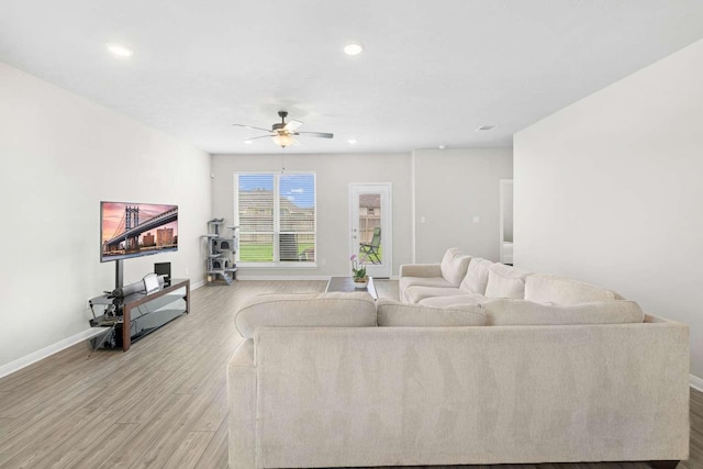 1925 Viva Rd, Bryan, TX 77807 - living room with wood finished floors, a ceiling fan, and recessed lighting
