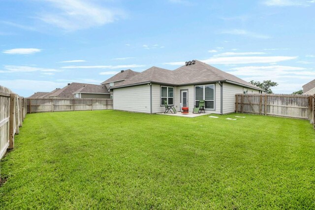 1925 Viva Rd, Bryan, TX 77807 - back of property with a fenced backyard and a patio