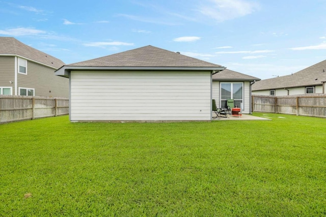 1925 Viva Rd, Bryan, TX 77807 - rear view of house with a fenced backyard, a patio, and roof with shingles